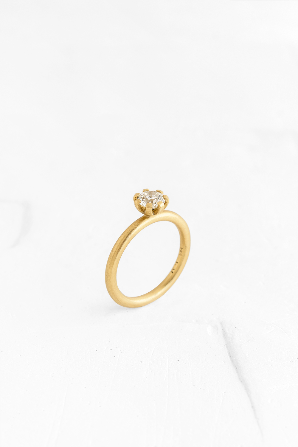 The ultimate diamond ring is here! Embedded with a shiny diamond in the "flower stud" technique, ... - View 2