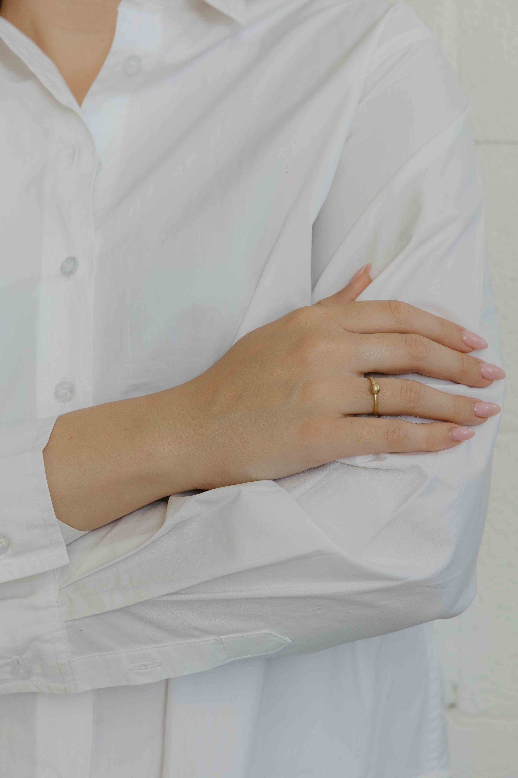 The perfect formalistic ring: a chunk of gold shaped into a flawless ball, placed on a simple hoop. - View 3