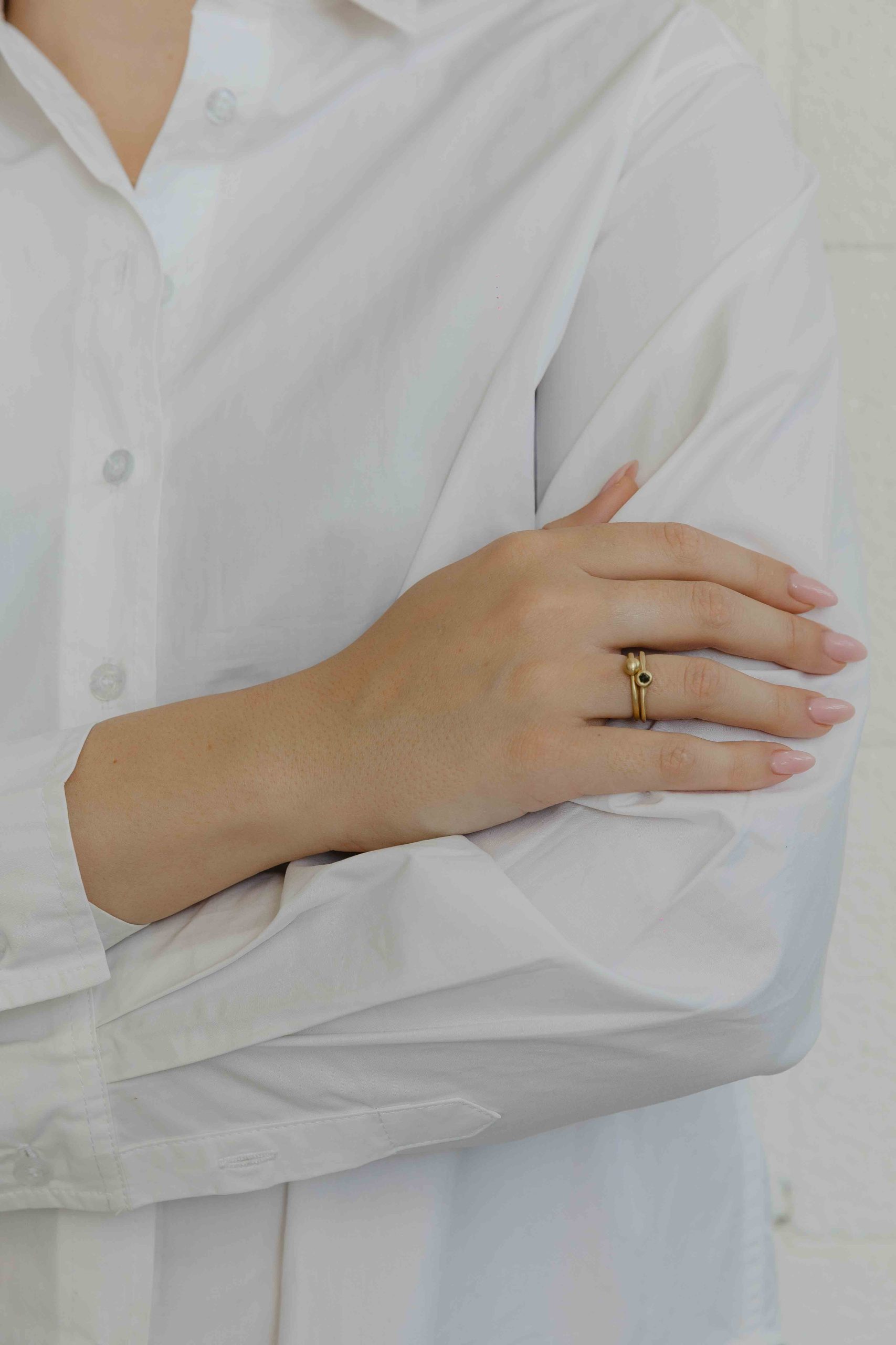 A handmade element in the shape of a hollow ball is set on top of the band, in which a small Onyx... - View 4