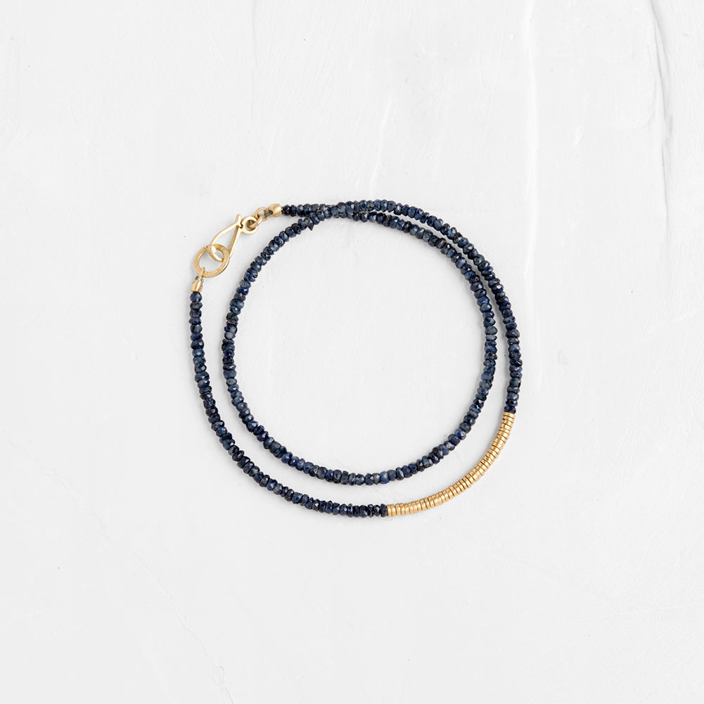 Majestic gemstones are combined with round gold links and a handcrafted gold clasp. This stunnin...