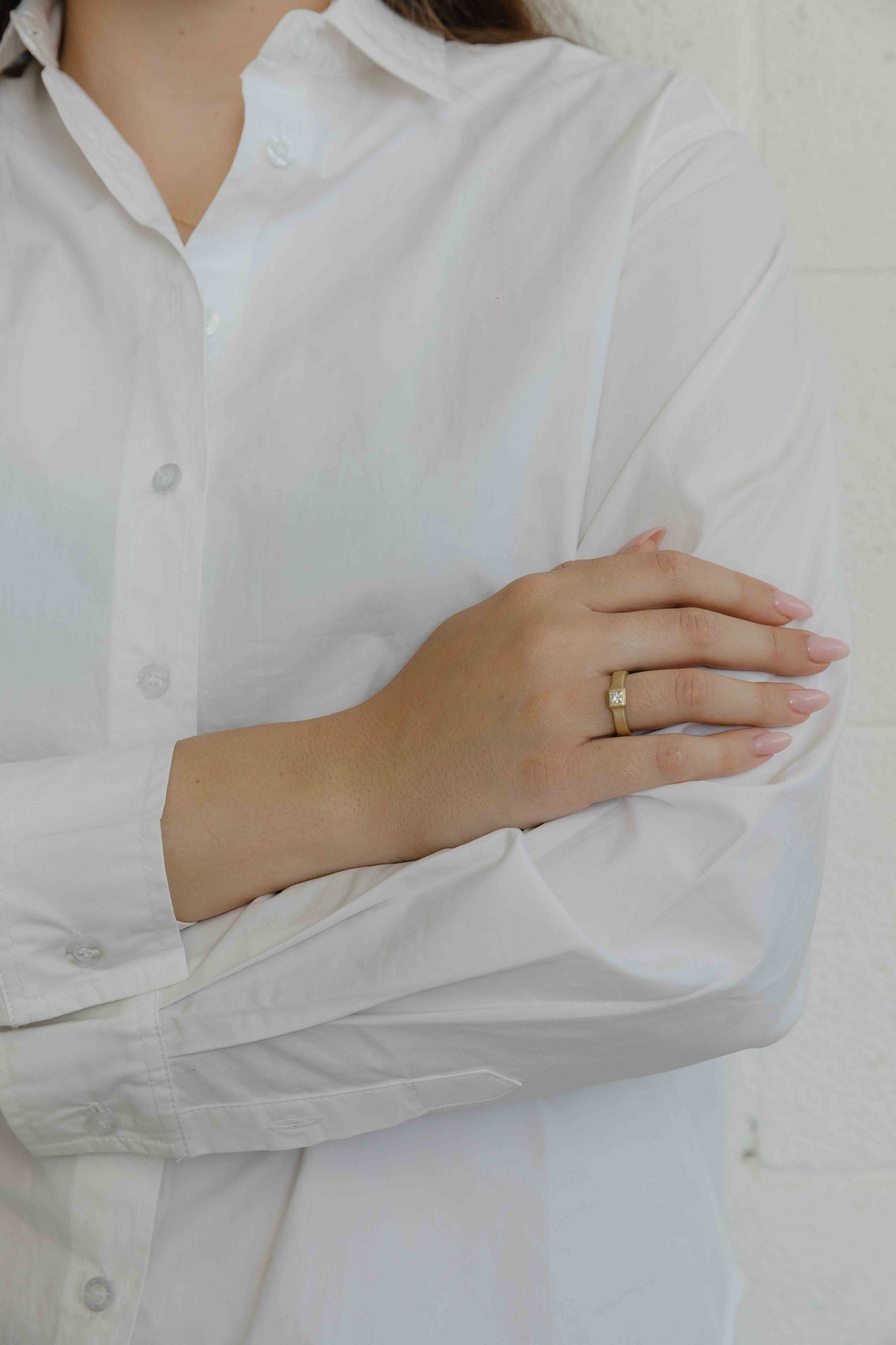 The band and bezel are both crafted into one fluid piece. A princess cut diamond 0.30 CT is set a... - View 3