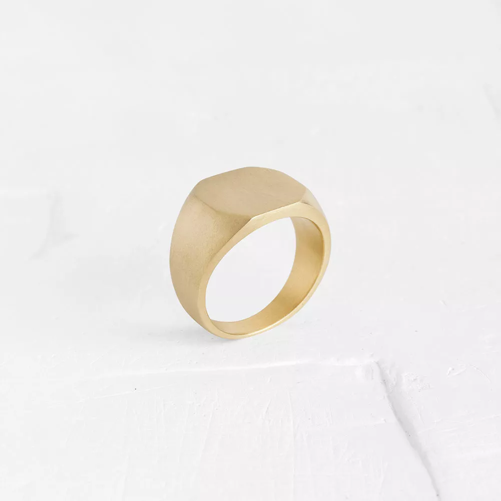 This signet ring has a squared shaped surface & unique cuts