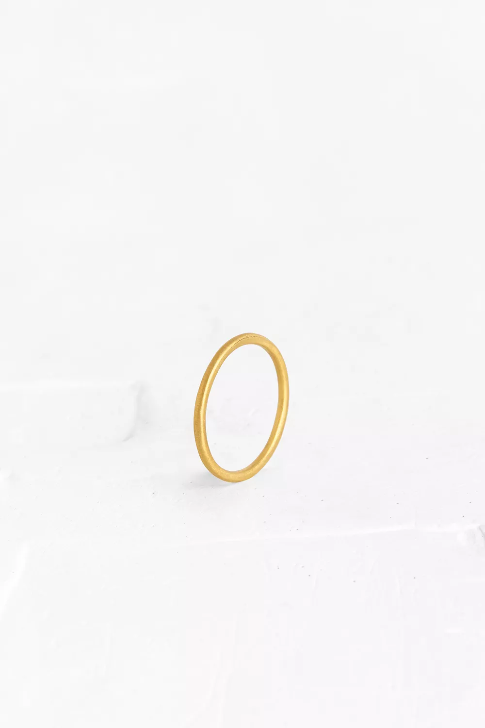 This minimalistic ring is crafted as a thin round band. It is perfect as a marriage ring, but als...