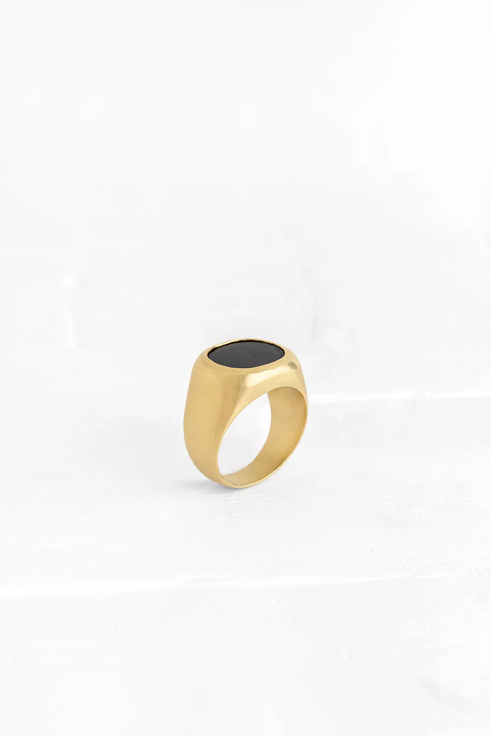 A true statement piece: this smoothed signet ring is embedded with an Onyx.