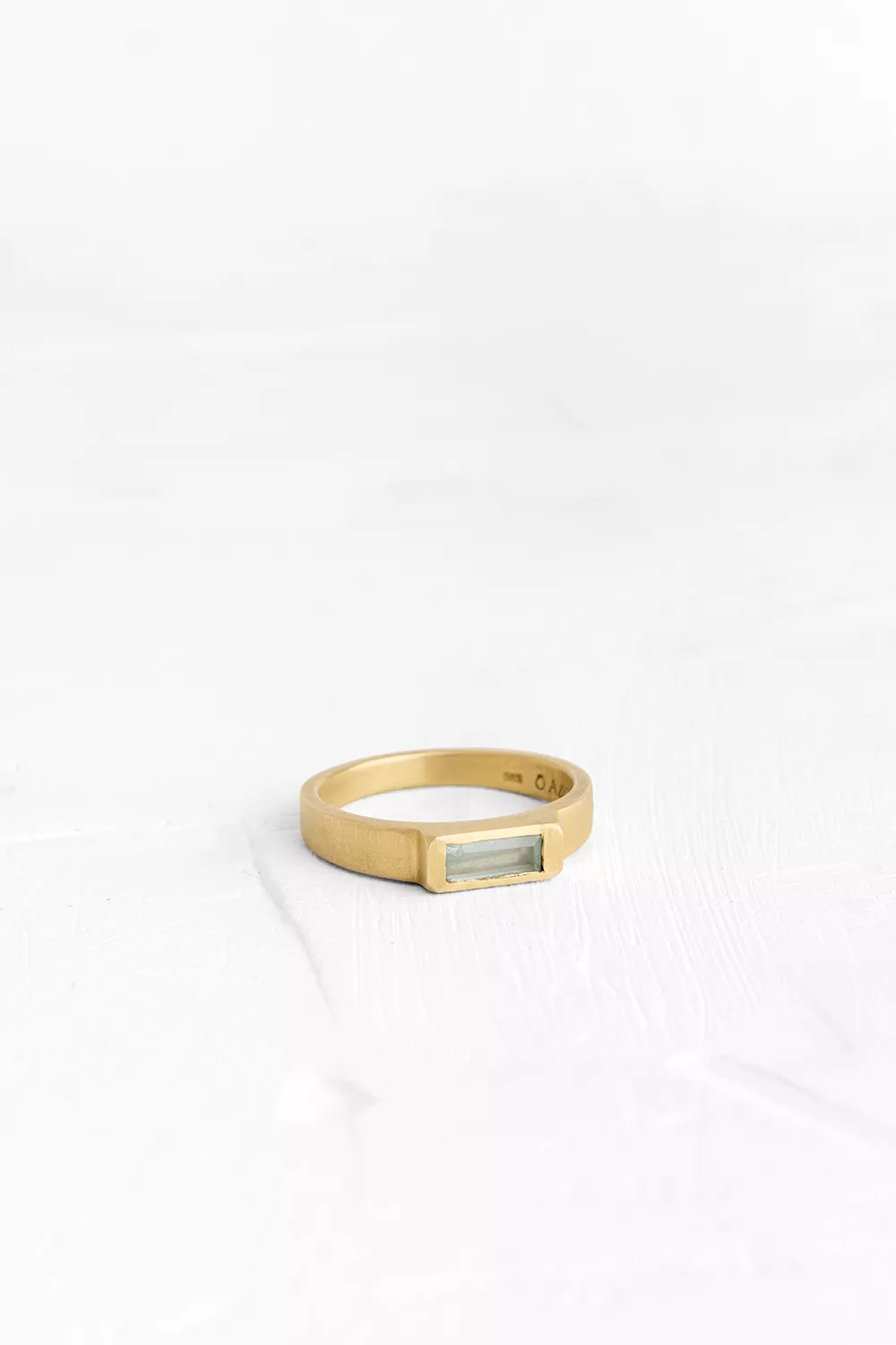 This ring is adorned with a handmade flatten bezel set with Aquamarine.