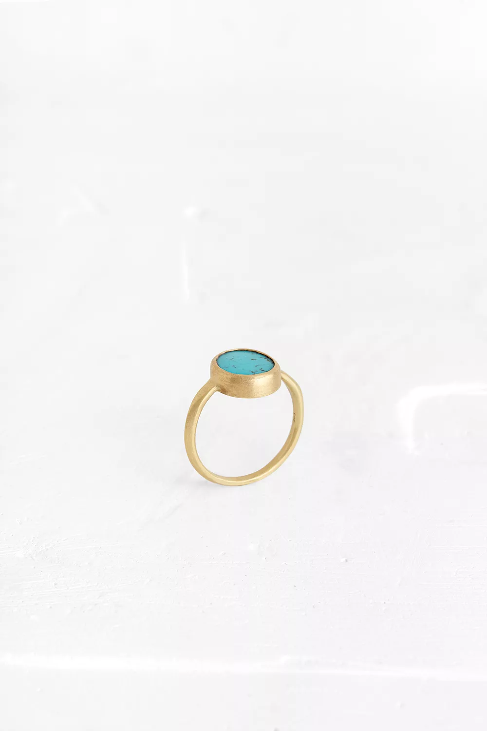 This 14K gold ring has an elegant style, set with a one of a kind Turquoise.
