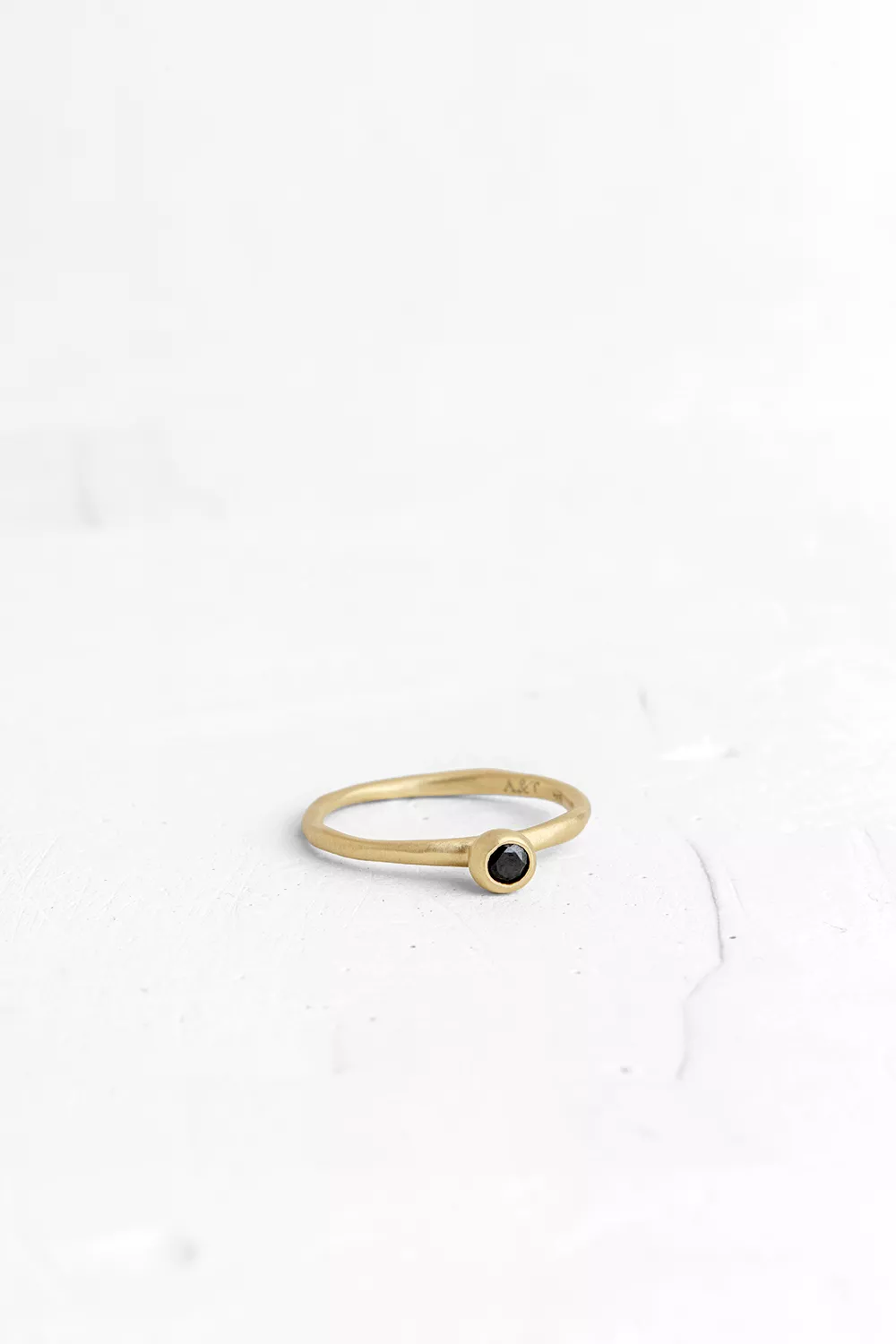 A handmade element in the shape of a hollow ball is set on top of the band, in which a small Onyx...