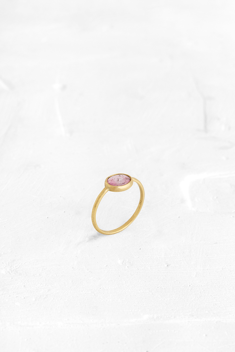 A one-of-a-kind thin ring, set with sliced stones. The setting band cases the selected stone, dif... - View 2
