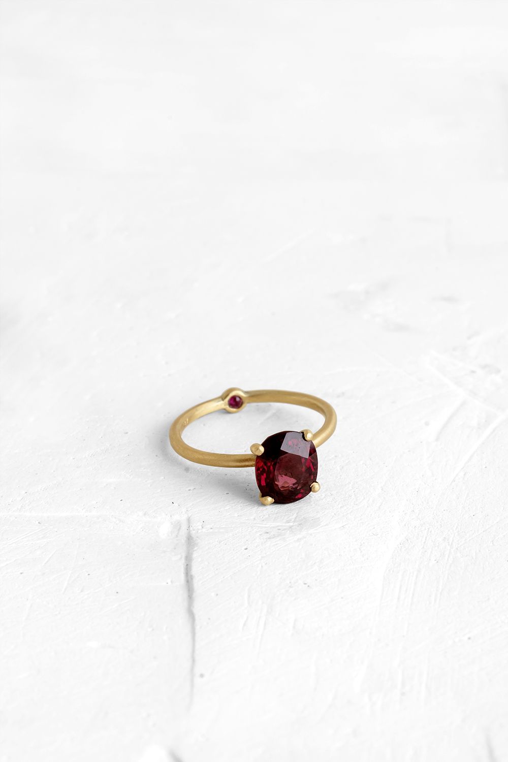 A thin, hoop ring with a setting for a stone or a diamond. The gem shines in its full glory, expo...