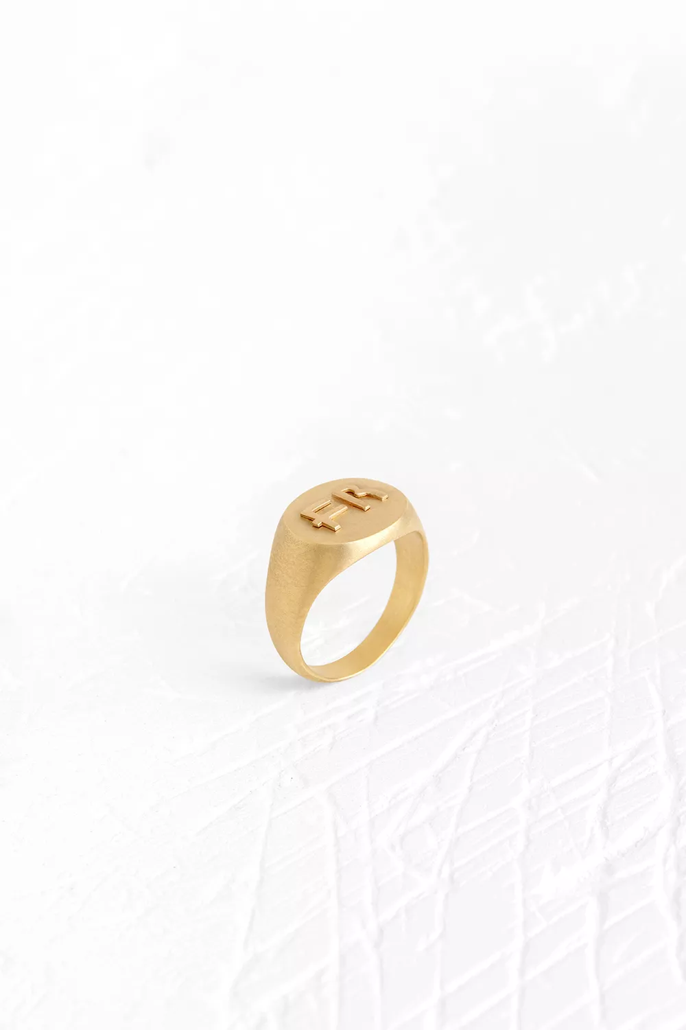 Large oval signet ring featuring a sleek golden plateCustomizable with your choice of 2 initi...