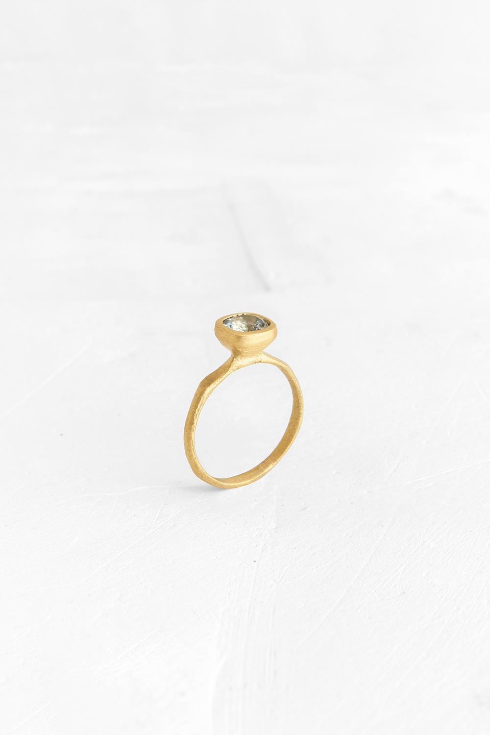 This Aquamarine is the beating-heart of this delicate ring. The raw nature of the gold band makes... - View 2
