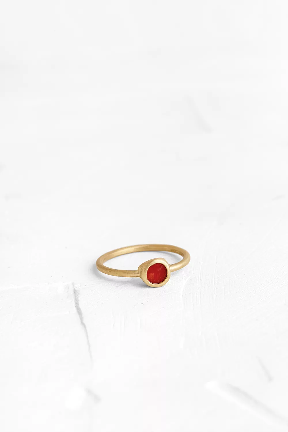 A timeless piece: this gold ring features a handmade bezel set with a rectangle one of a kind Coral.
