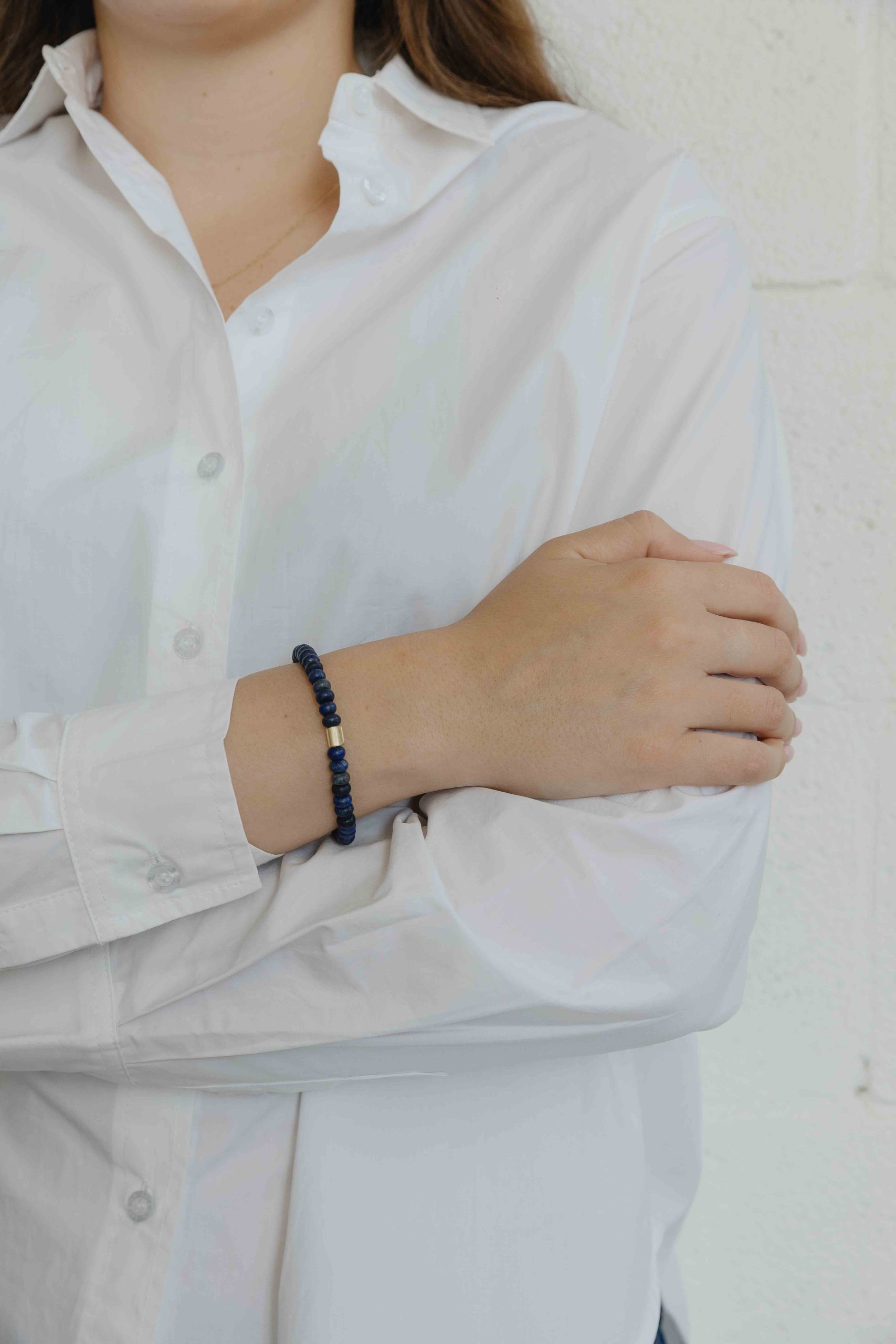 This bracelet is made of a pack of black Onyx. A gold "wing" shaped bead is also added, as a fina... - View 3