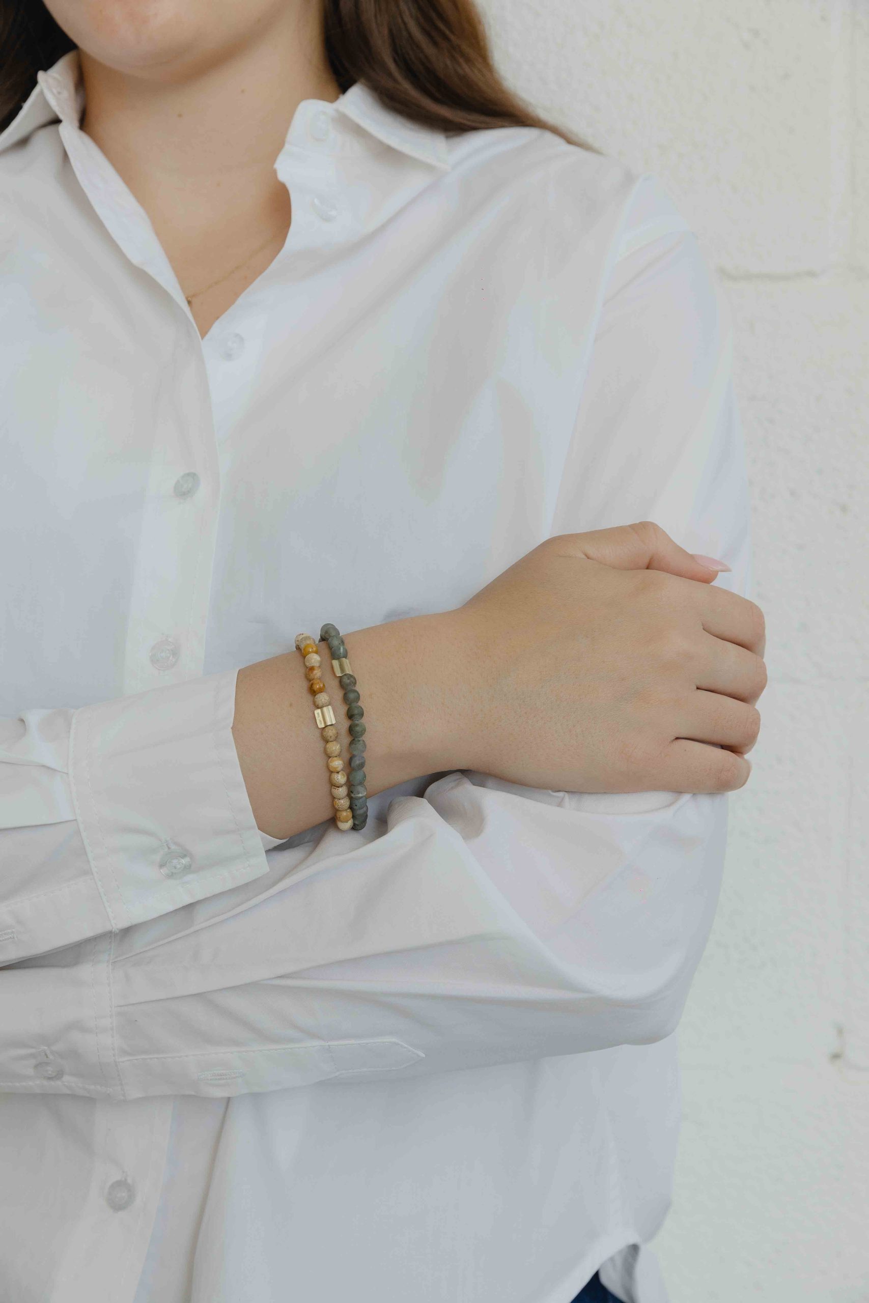 This bracelet is made of a pack of black Onyx. A gold "wing" shaped bead is also added, as a fina... - View 4