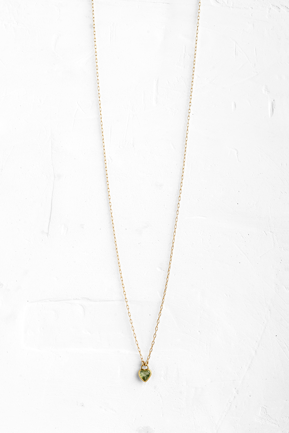 A handmade pendant is set with Green Tourmaline stone in a heart shape which hangs on a delicate ... - View 2