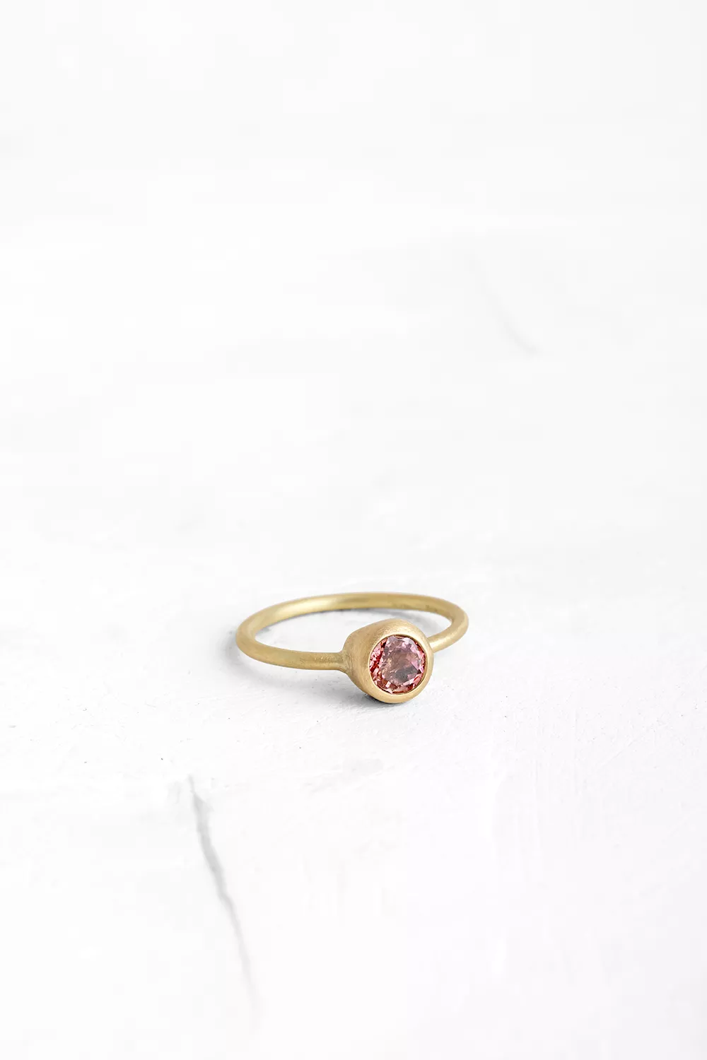 A timeless piece: this gold ring features a handmade bezel set with a round Pink Tourmaline.