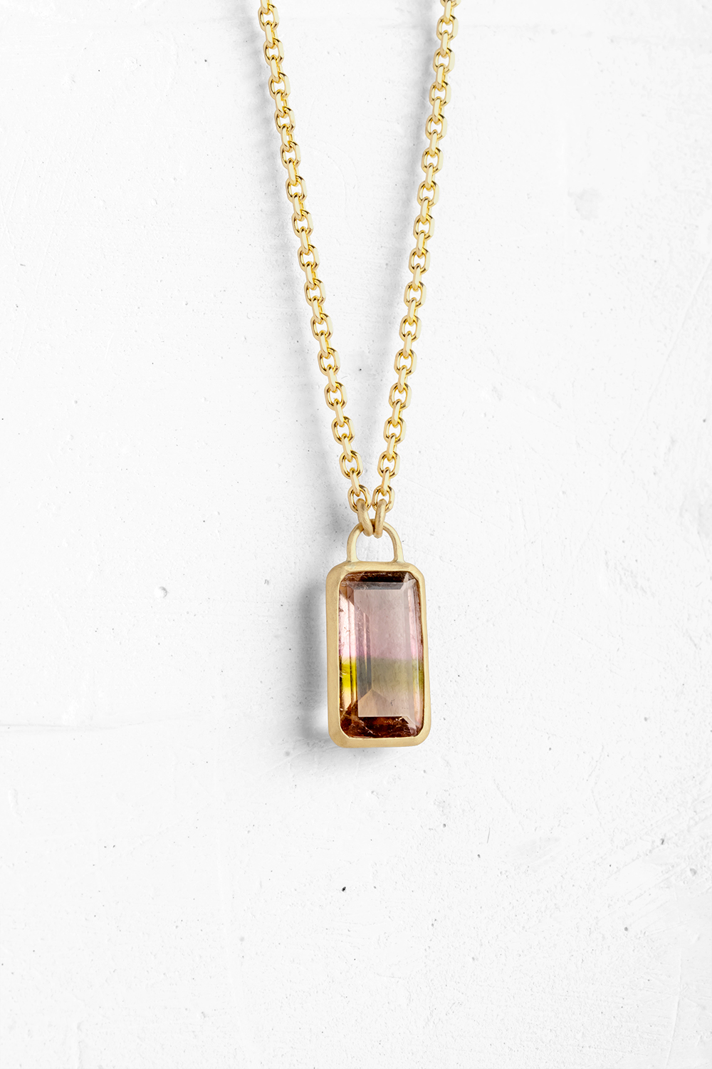 A handmade pendant embedded with a light pink Tourmaline with a touche of green. This is the ulti...