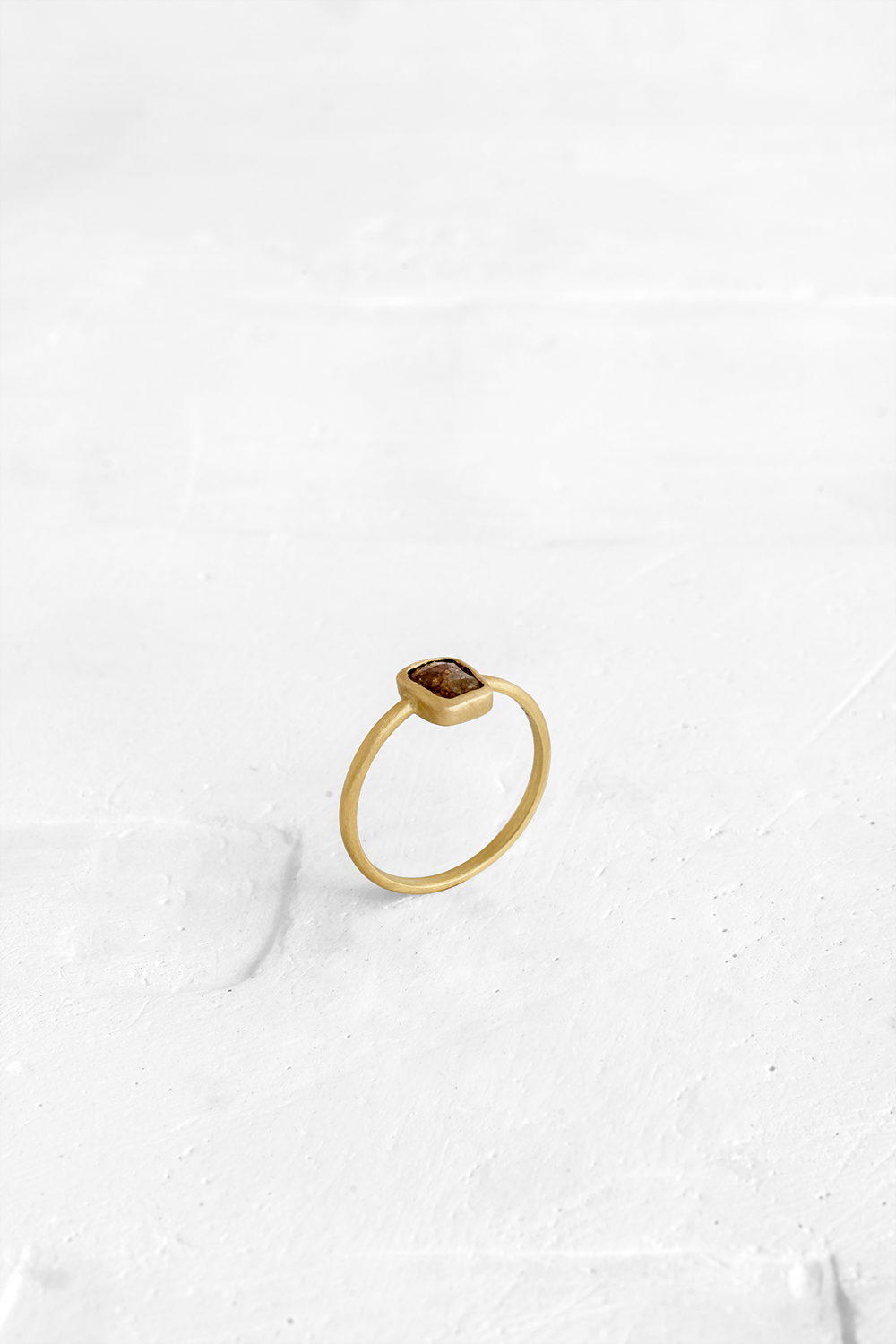 A one-of-a-kind thin ring, set with sliced stones. The setting band cases the selected stone, dif... - View 2