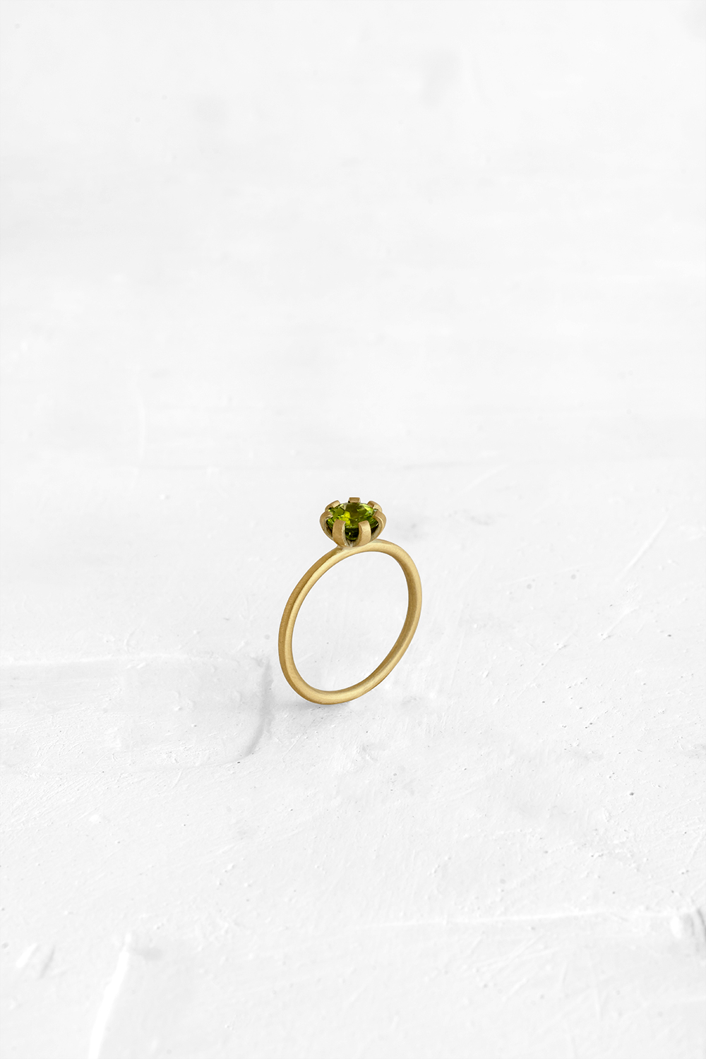 A thin, hoop ring with a setting for a stone or a diamond. The gem shines in its full glory, expo... - View 2