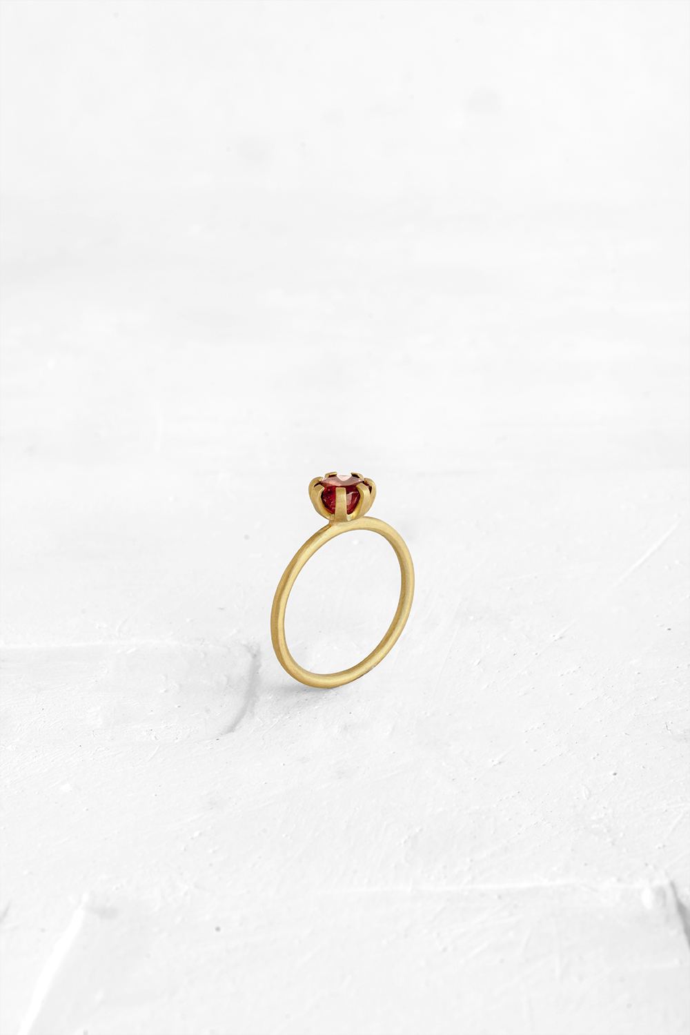 A thin, hoop ring with a setting for a stone or a diamond. The gem shines in its full glory, expo... - View 2