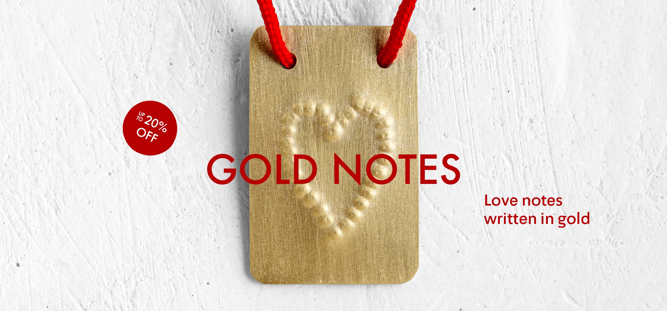 A gold rectangle with a heart embossed in the center hangs by a red string. Text reads: GOLD NOTES, Love notes written in gold, and a red circle says Up to 20% OFF. Background is a white textured surface.