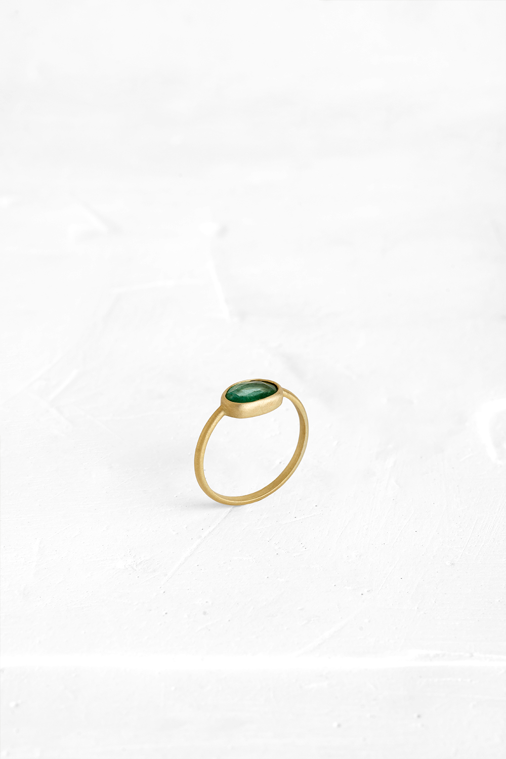 A one-of-a-kind thin ring, set with sliced stones. The setting band cases the selected stone, dif... - View 2