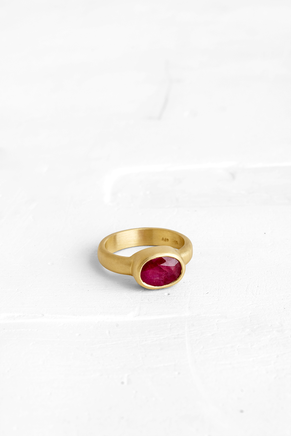 The bold version of our classic vase ring: this one is set with a dreamy dark pink Ruby