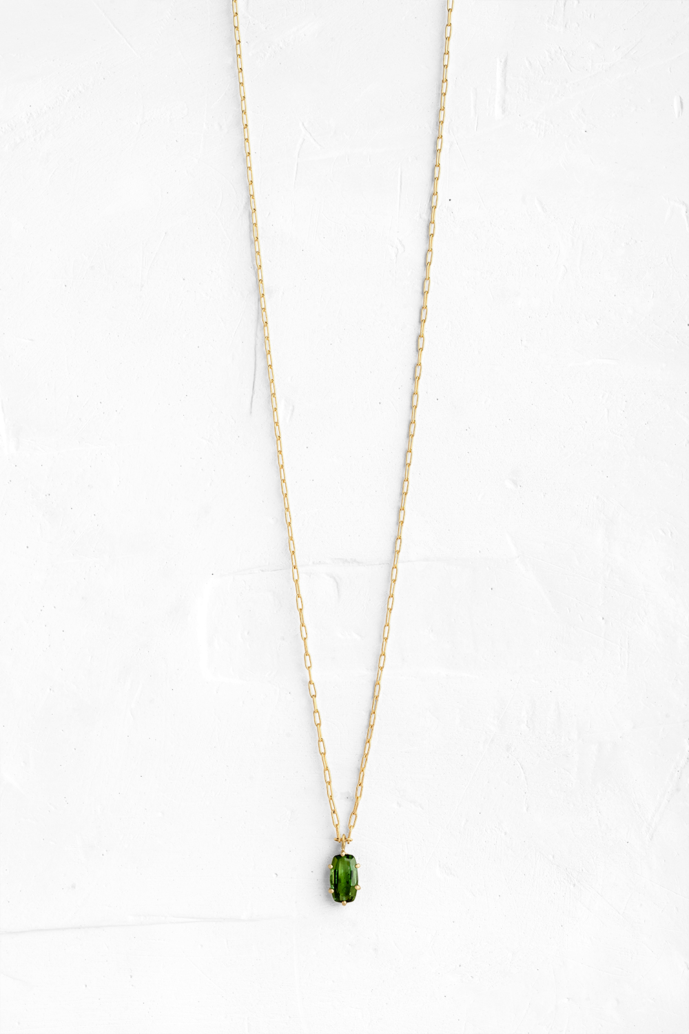 A thin, gold chain, with a beautiful setting holding a gem exposed from all sides, allowing its c... - View 2