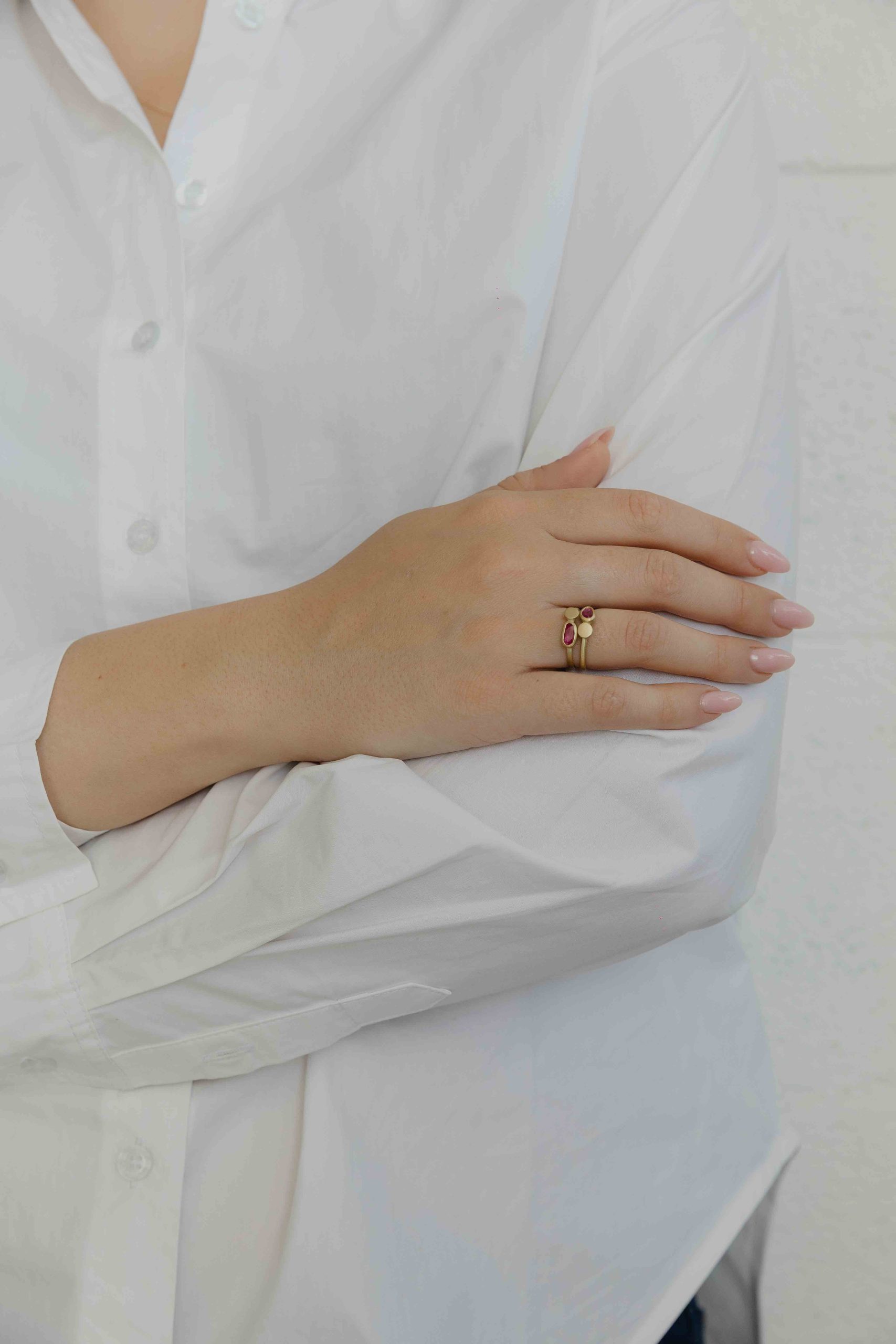 A gentle gold ring set with a slice of Ruby and a gold element coexisting side by side.
Each rin... - View 5