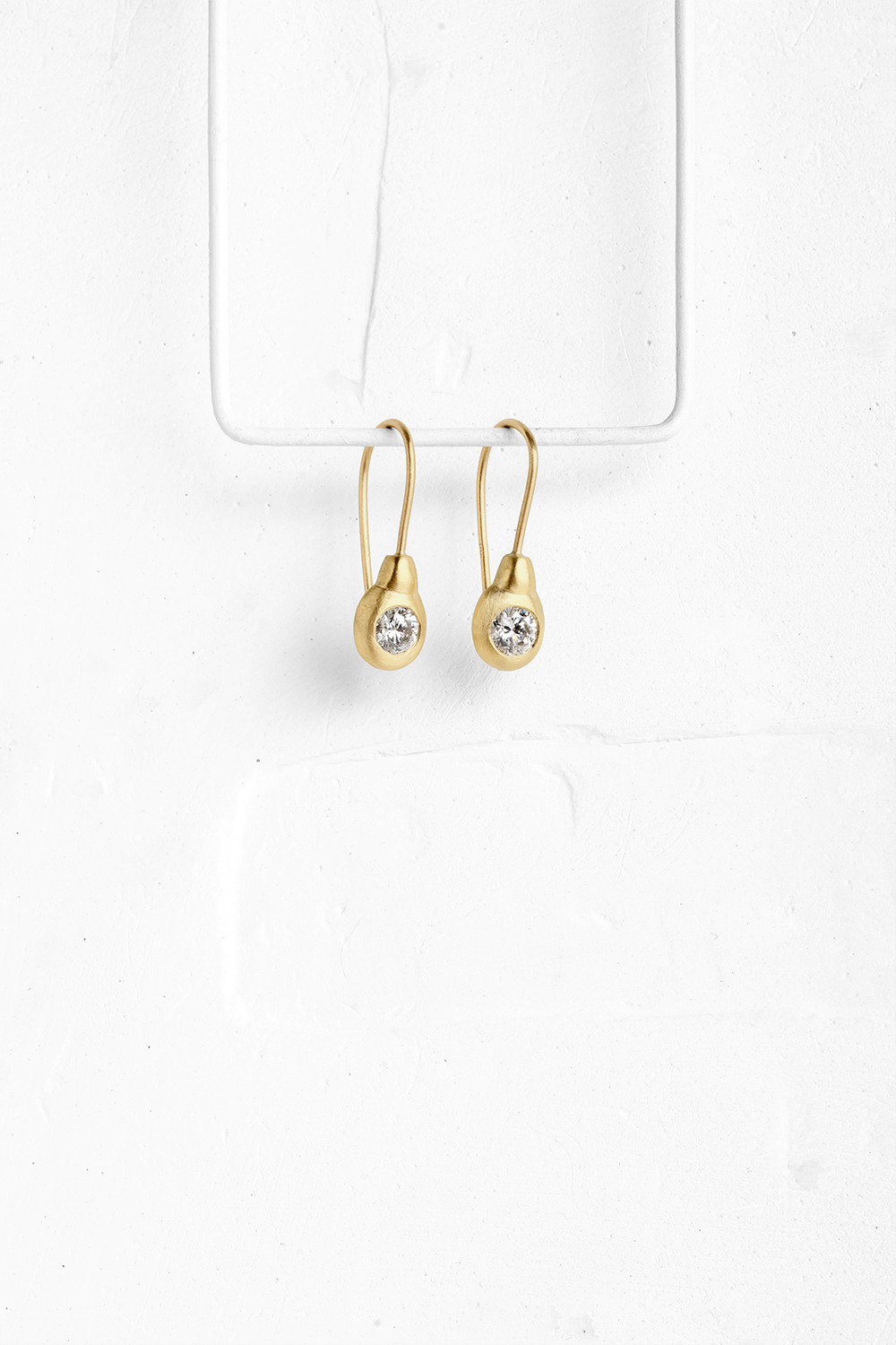 Gold earrings set with diamonds, shaped in a pear like form - View 2