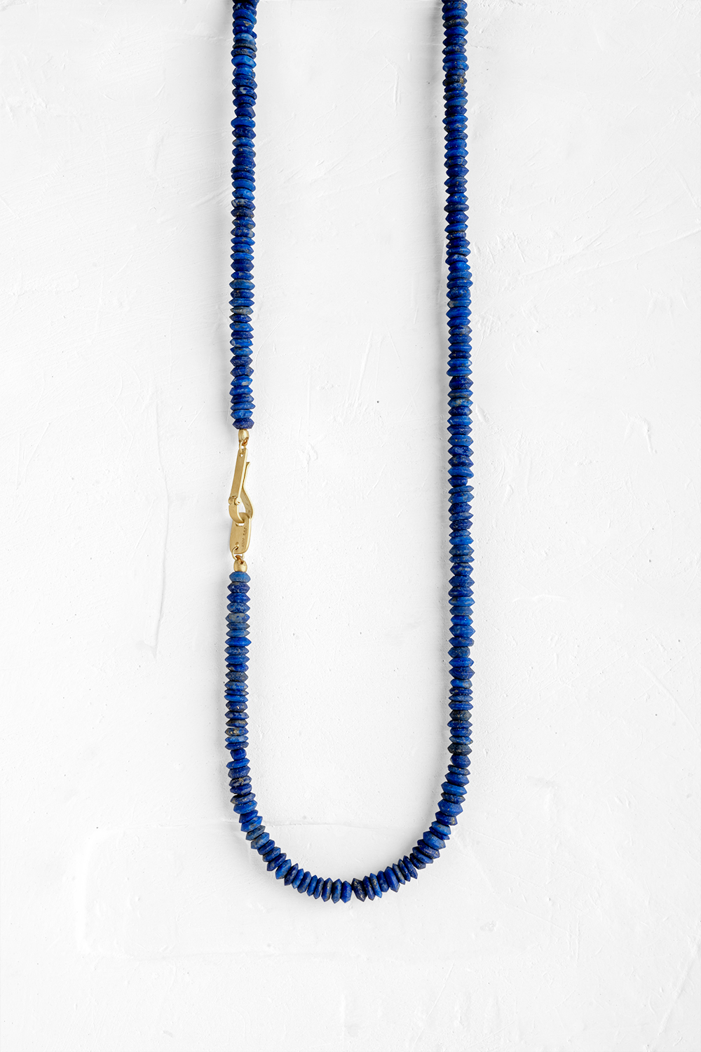 Our interpretation of the classic gems necklace:  a natural blue lapis gems combined with a hand...