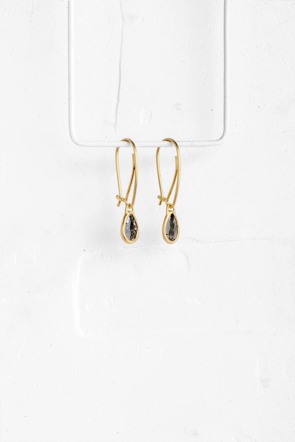 A pair of a drop shaped Diamante stones wrapped in gold hang from hand crafted wire hooks

&nbsp; - View 2