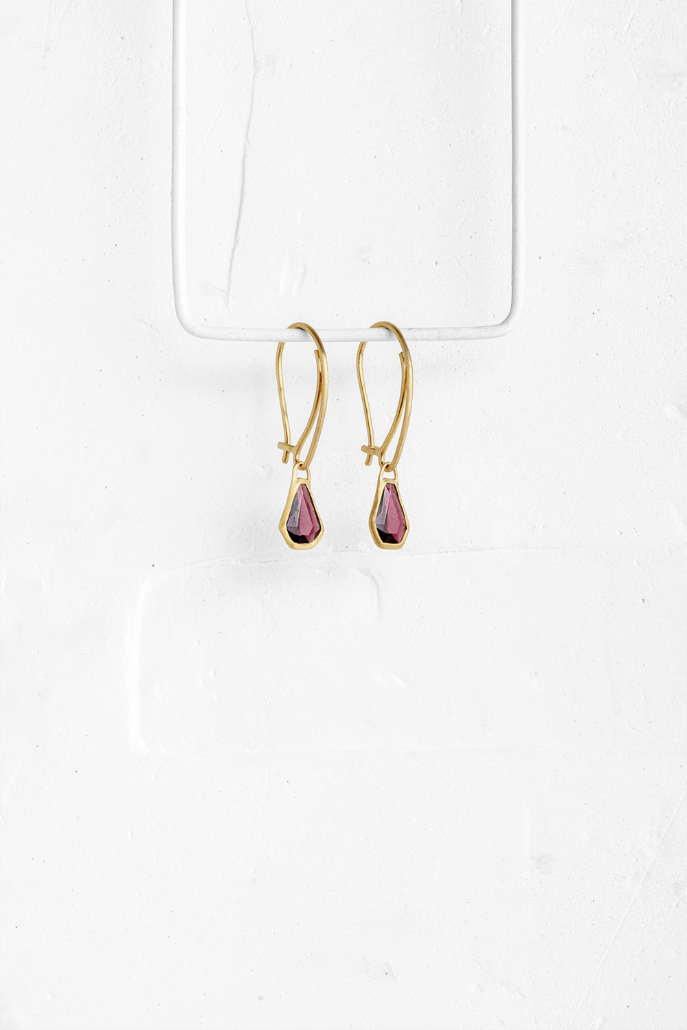 A pair of hexagonal pink Granet stones wrapped in gold hang from hand crafted wire hook

&nbsp; - View 2