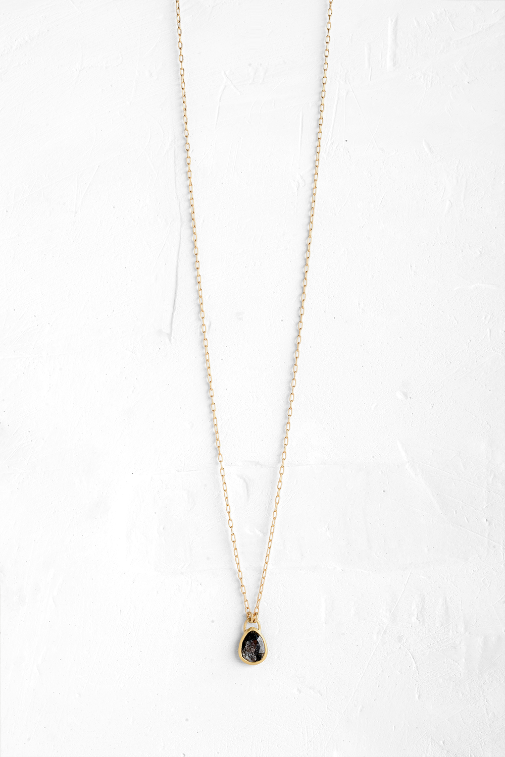 A delicate handmade pendant is embedded with a one of a kind Diamant - View 2