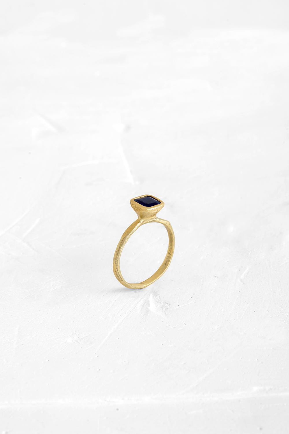 This Blue Saphire is the beating-heart of this delicate ring. The raw nature of the gold band mak... - View 2