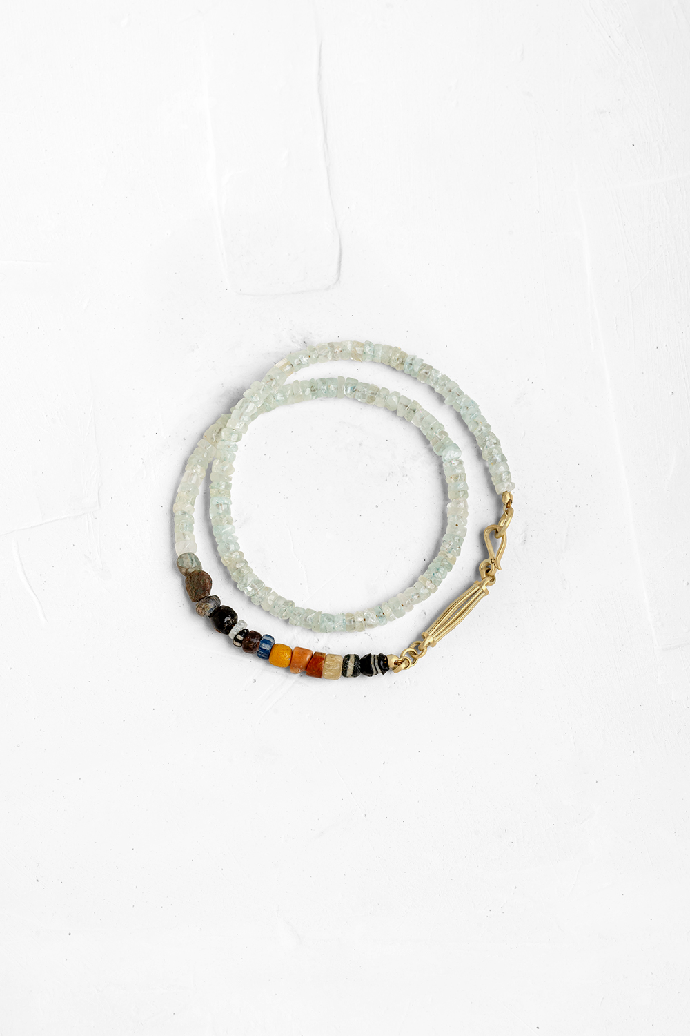 Classic Aqua Marine bracelet designed with a unique handcrafted gold element & clasp, and a mix o...