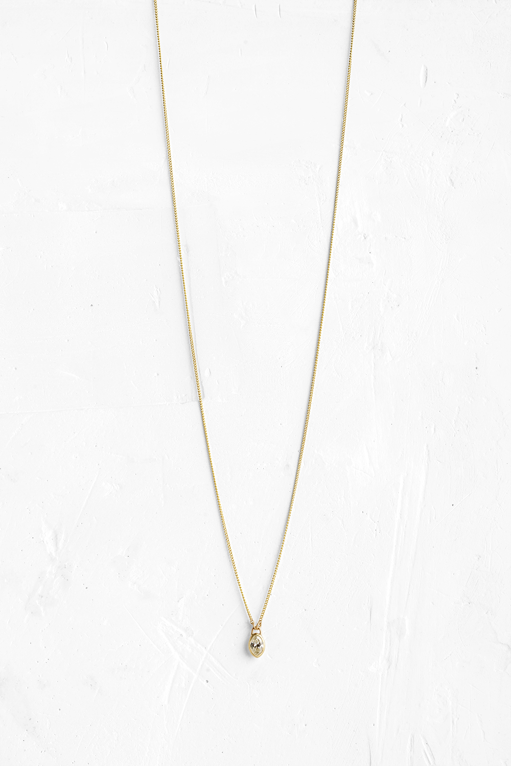 A handmade pendant is set with a Marquise Diamoned - 0.45 CT which hangs on a delicate chain - View 2