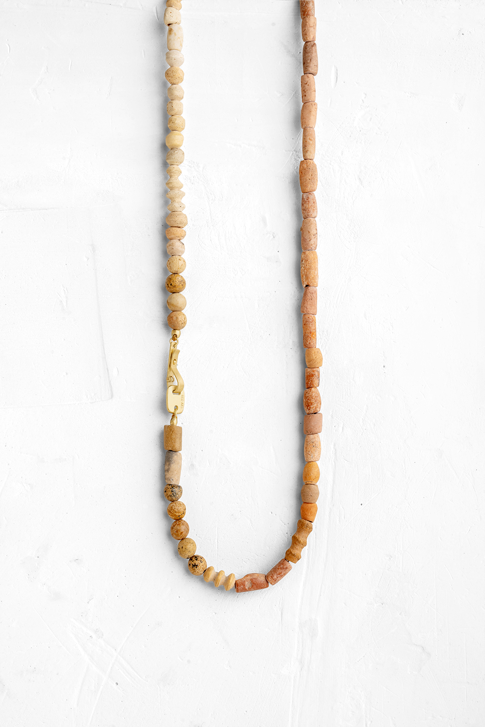 Our interpretation of the classic gems necklace:  a natural Cly stones combined with a handmade ...